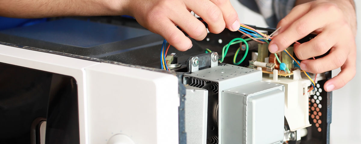 Domestic appliance circuitry panel under examination.