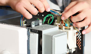Domestic appliance circuitry panel under examination.