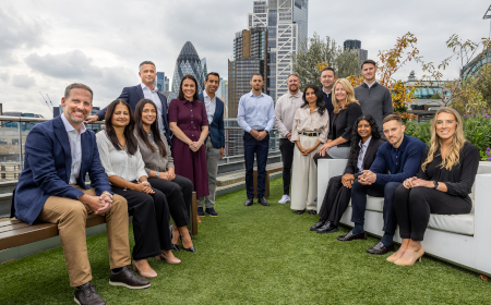 The Ventures team standing in front of the London skyline.