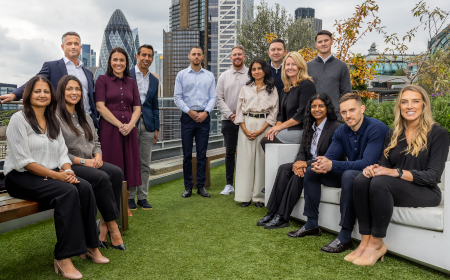 The Ventures team standing in front of the London skyline.