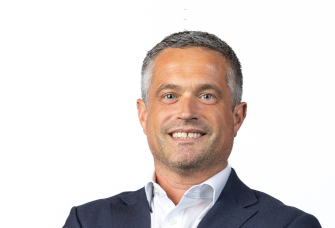 A professional headshot of Greg Brown.