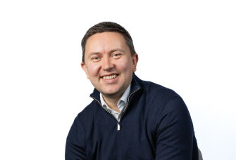 A professional headshot of Howard Zieminski.