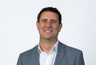 A professional headshot of Andrew Hunter.