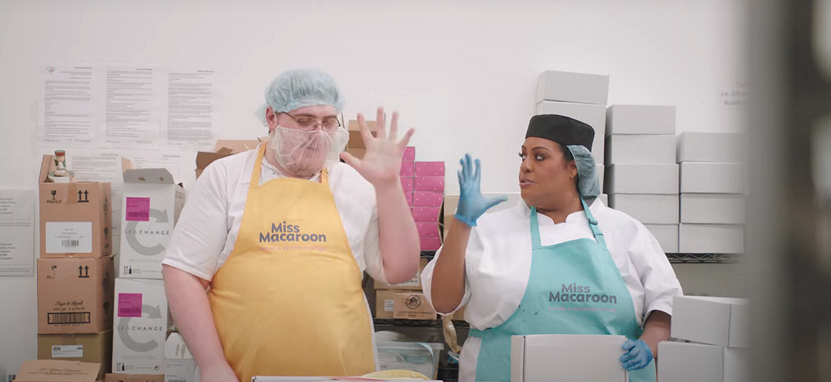 Alison Hammond and a worker pictured in the Miss Macaroon SME factory