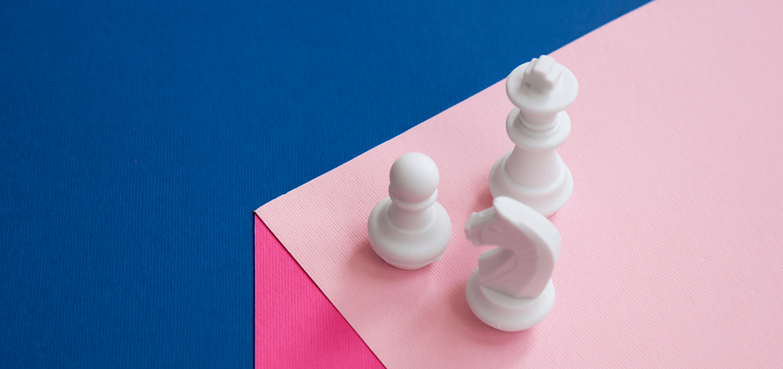 A few chess pieces on a table top