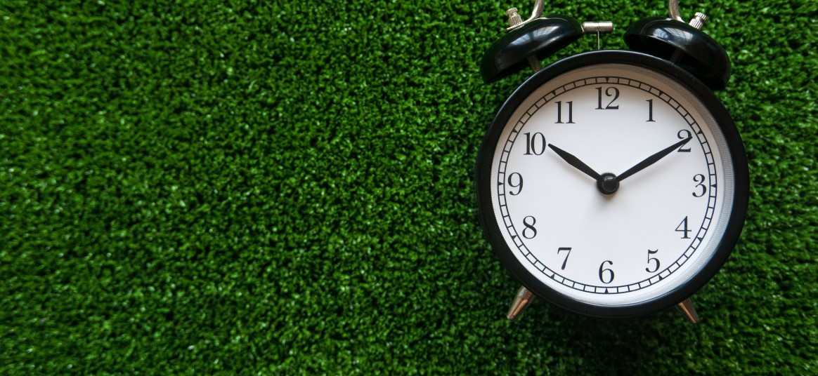 image of a clock on a green background