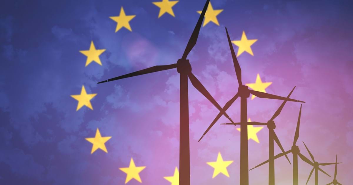 EU flag against image of wind turbines