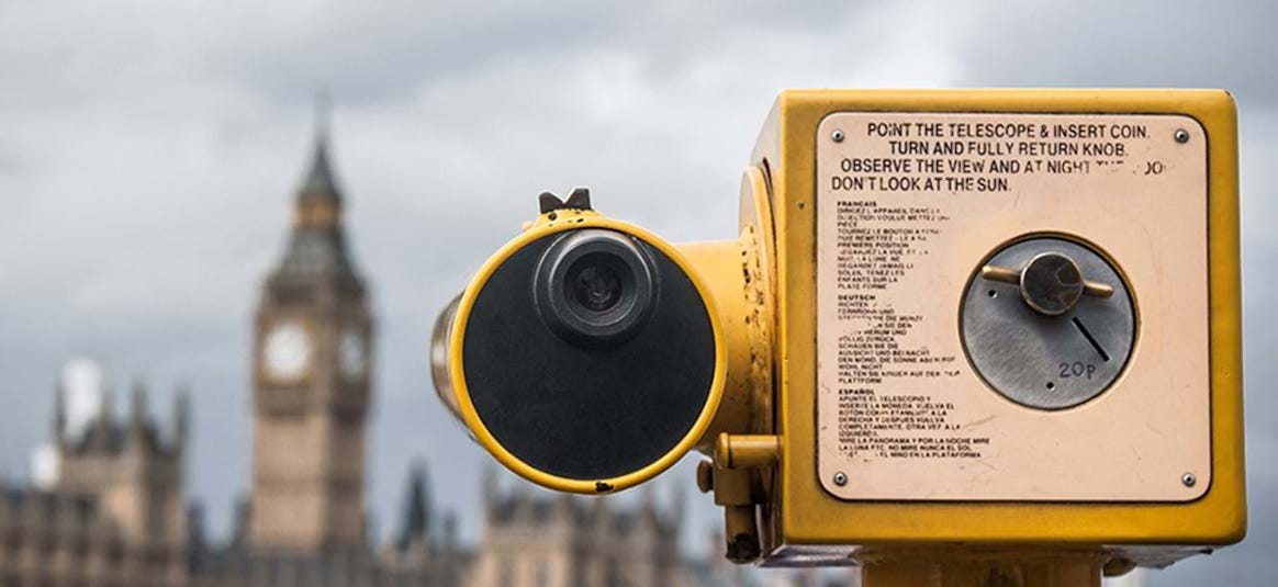 photo of coin operated telescope looking at houses of parliament
