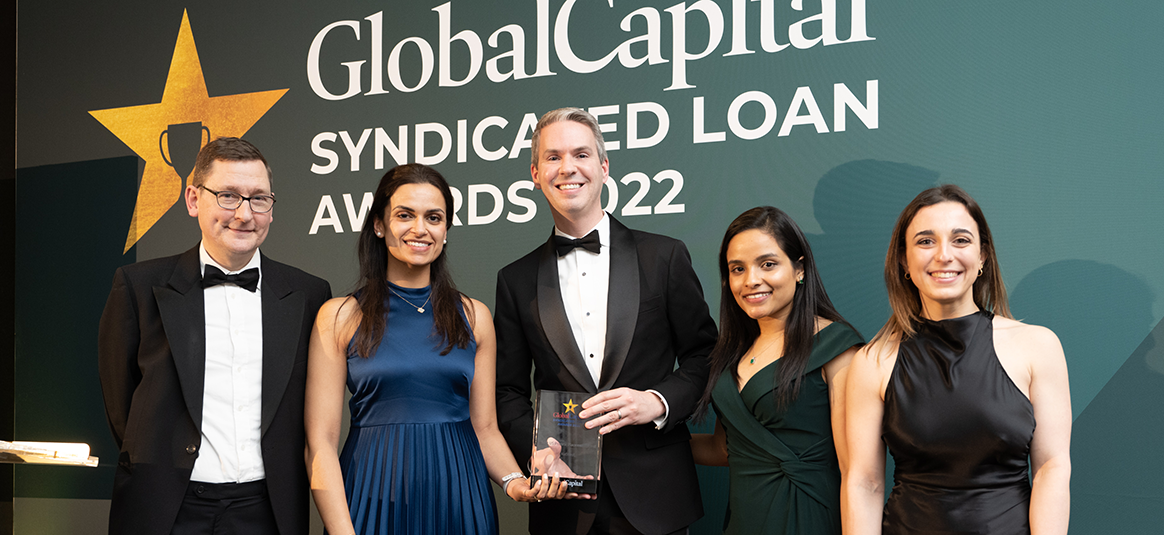 NatWest team in formal wear at GlobalCapital awards, with their “Best US Private Placement Agent 2022” glass ward.