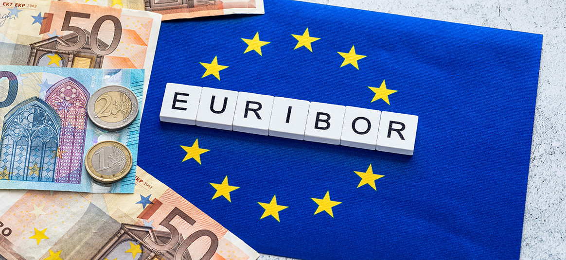 'Euribor' spelled on letter tiles beside mixed Euro currencies.