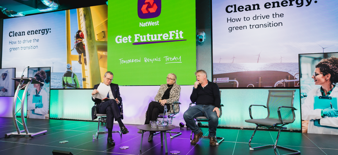 Photo of Get FutereFit event with three speakers on stage