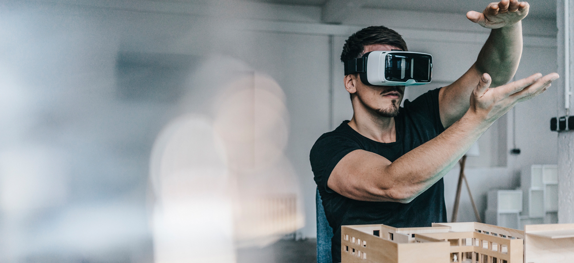 Photo of a man using a VR headset
