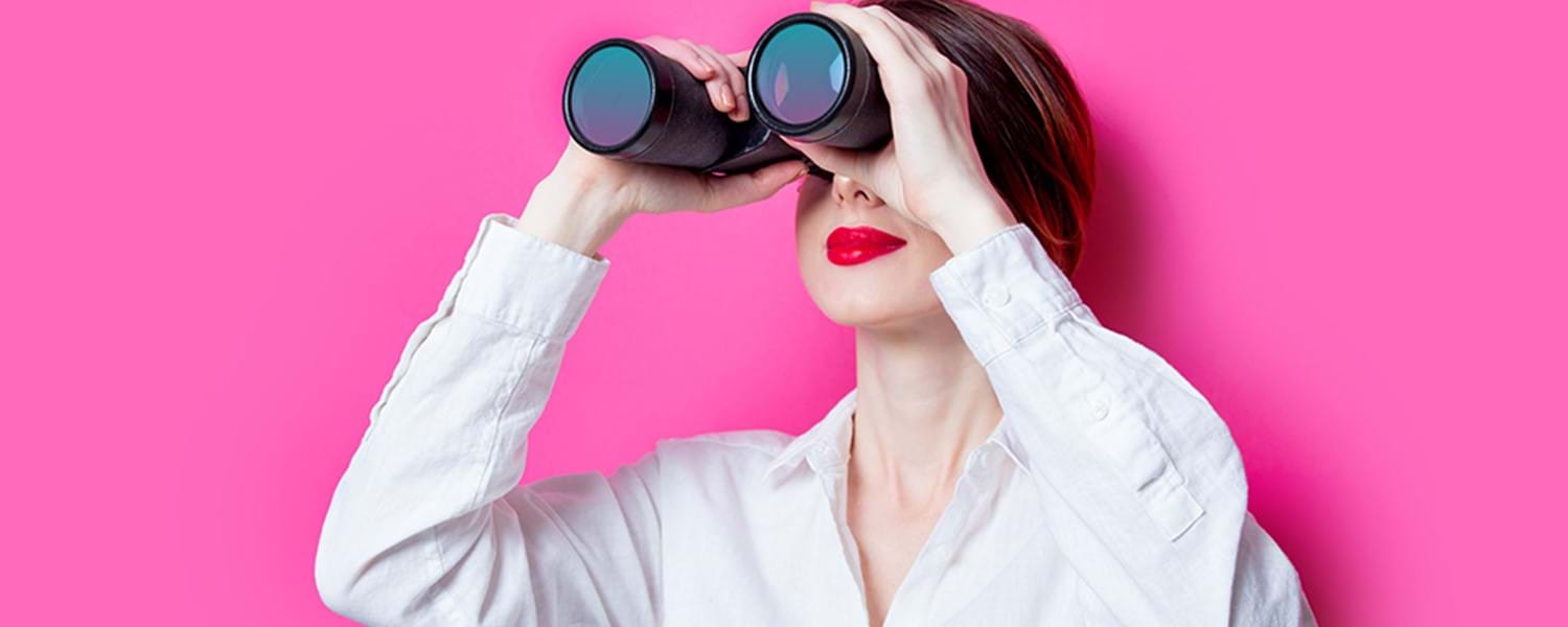 Image of woman looking through binoculars