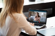 Photo of a woman with a laptop on a video call