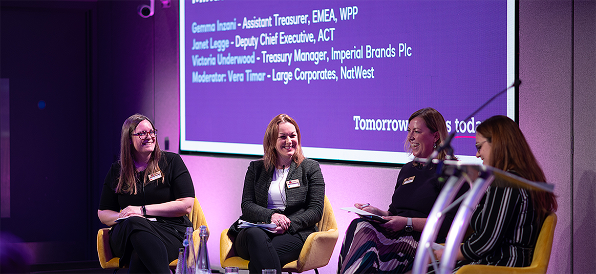 Panelists on stage at the Adopting a Growth Mindset panel at the Treasury Academy event