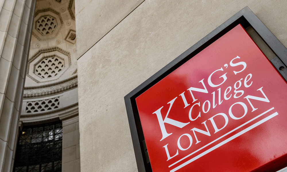 Photo of a red King’s College London plaque on the side of a building