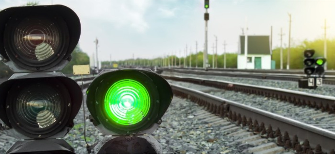 Railt track and green light signal.