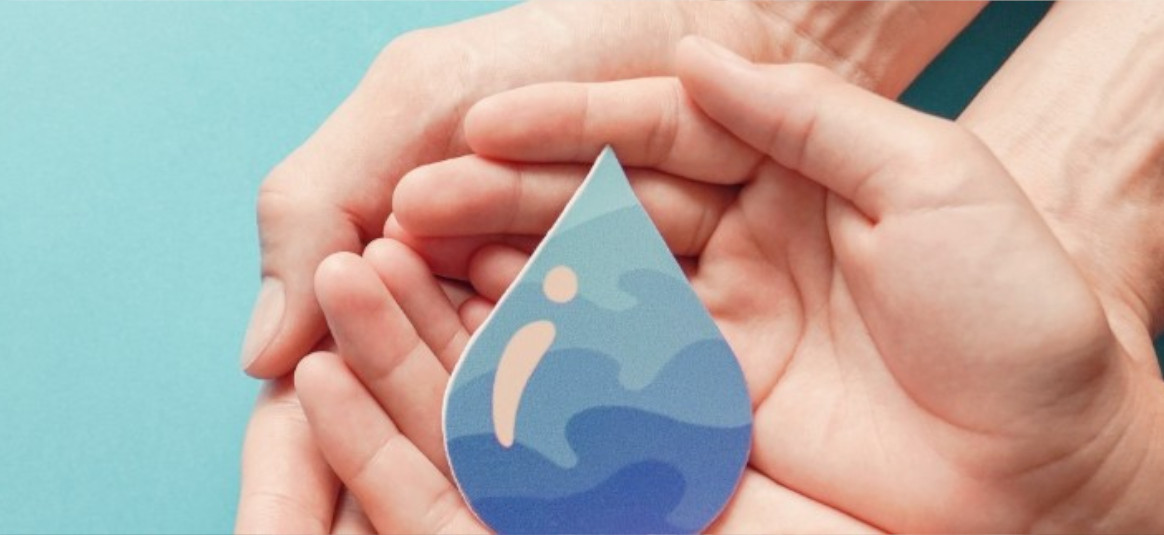 A child and parent cradle a card template of a water droplet in their hands.