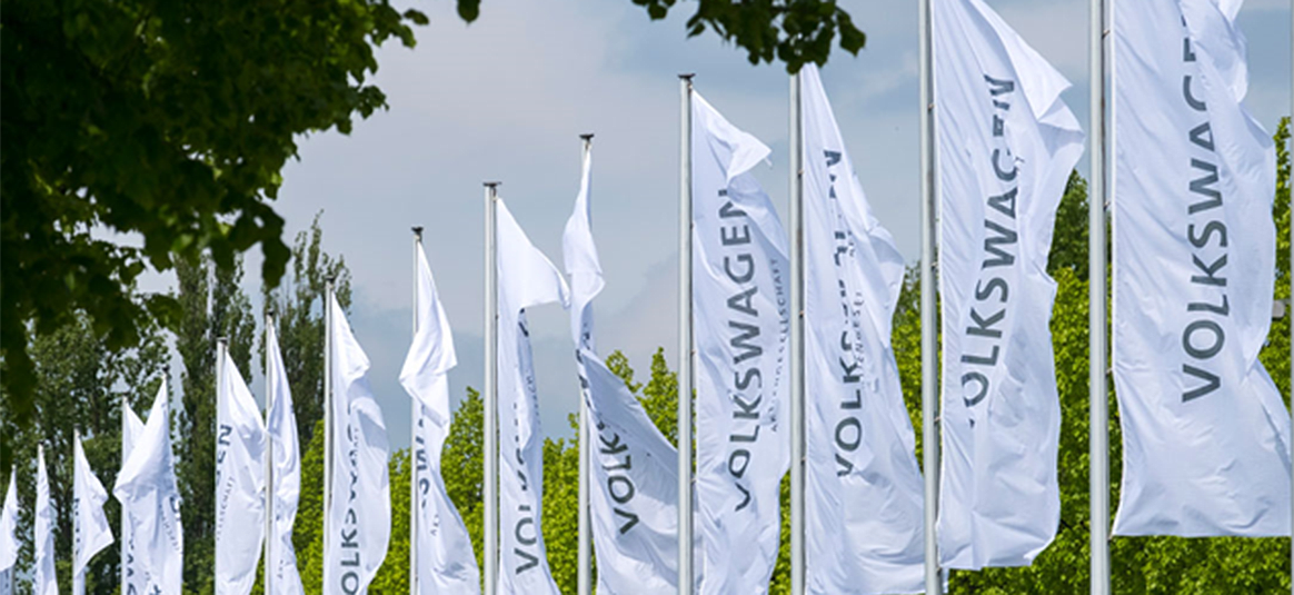 Flagpoles with Volkswagen branded flags on them.
