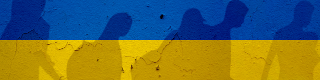 Shadows of refugees walking against an exterior wall, decorated in the Ukranian flag colours of blue and yellow. 