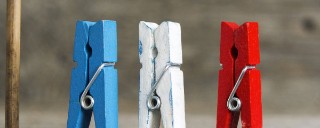 Blue, white and red clothes pegs representing French client, CADES.