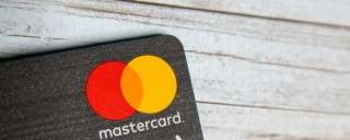 Photo of a bank card with the Mastercard logo in the corner