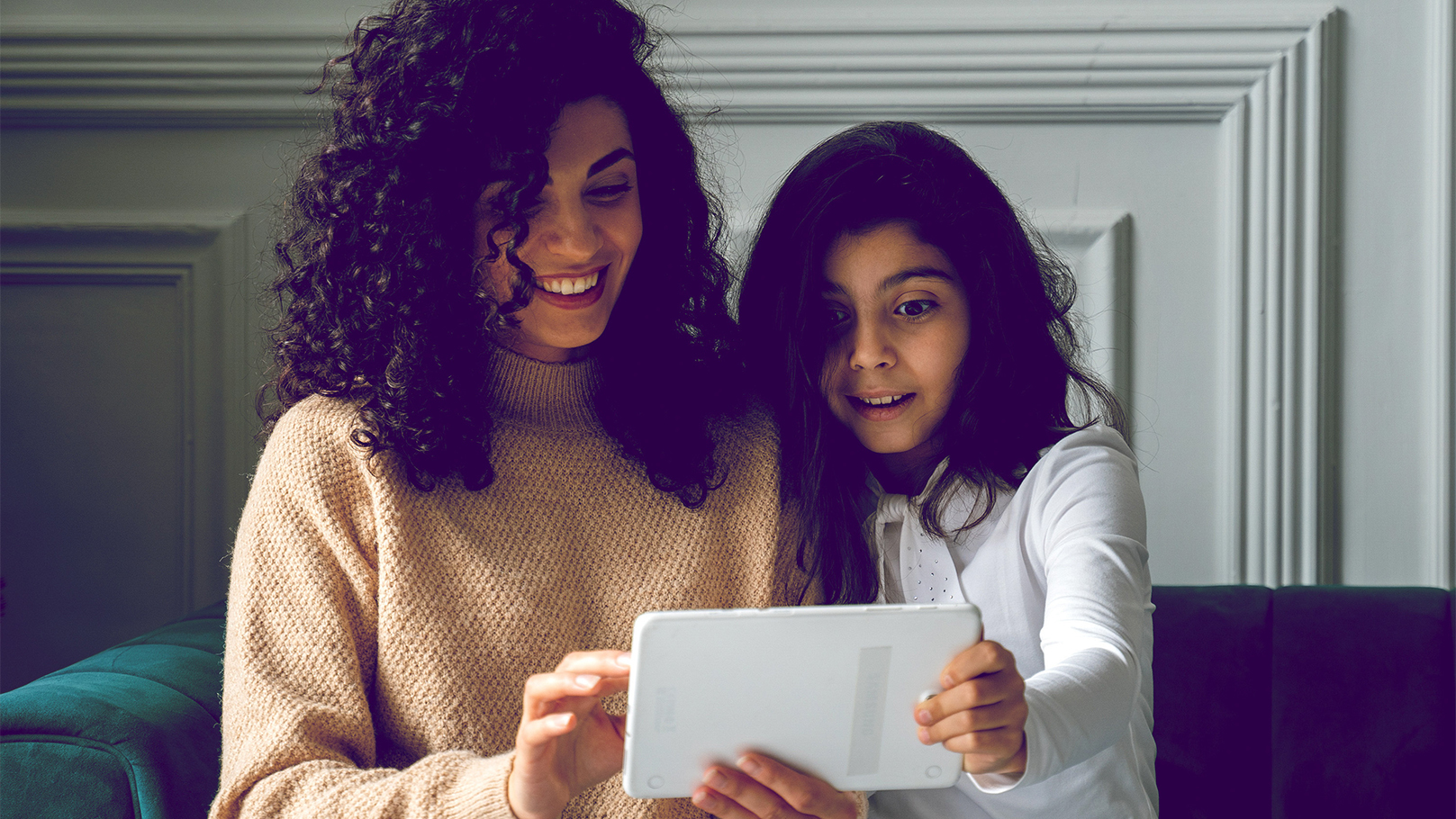 Mother and daughter on an ipad