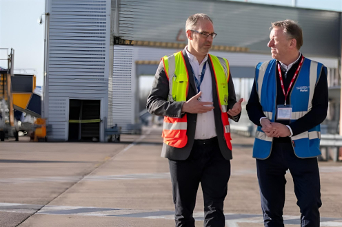 Men in hi vis at airport