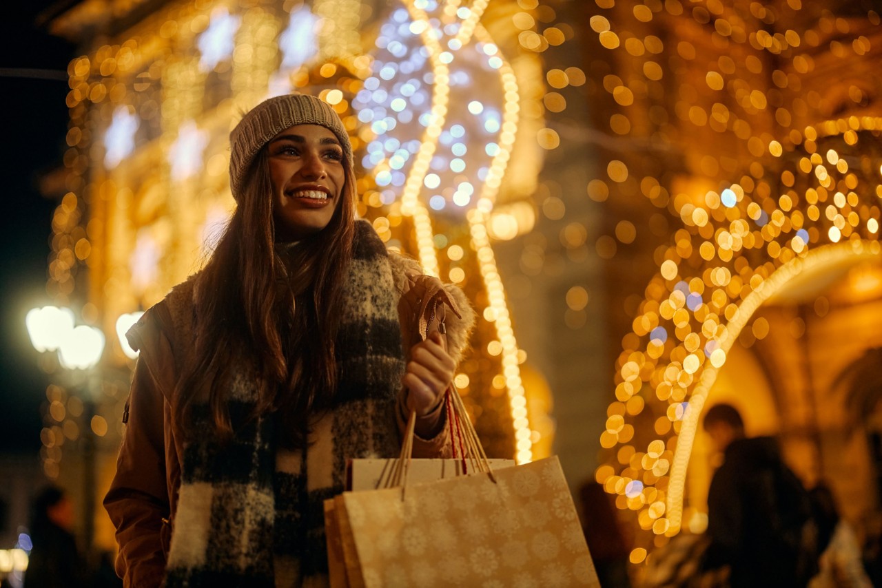 woman smiling with Christmas decorations in the background