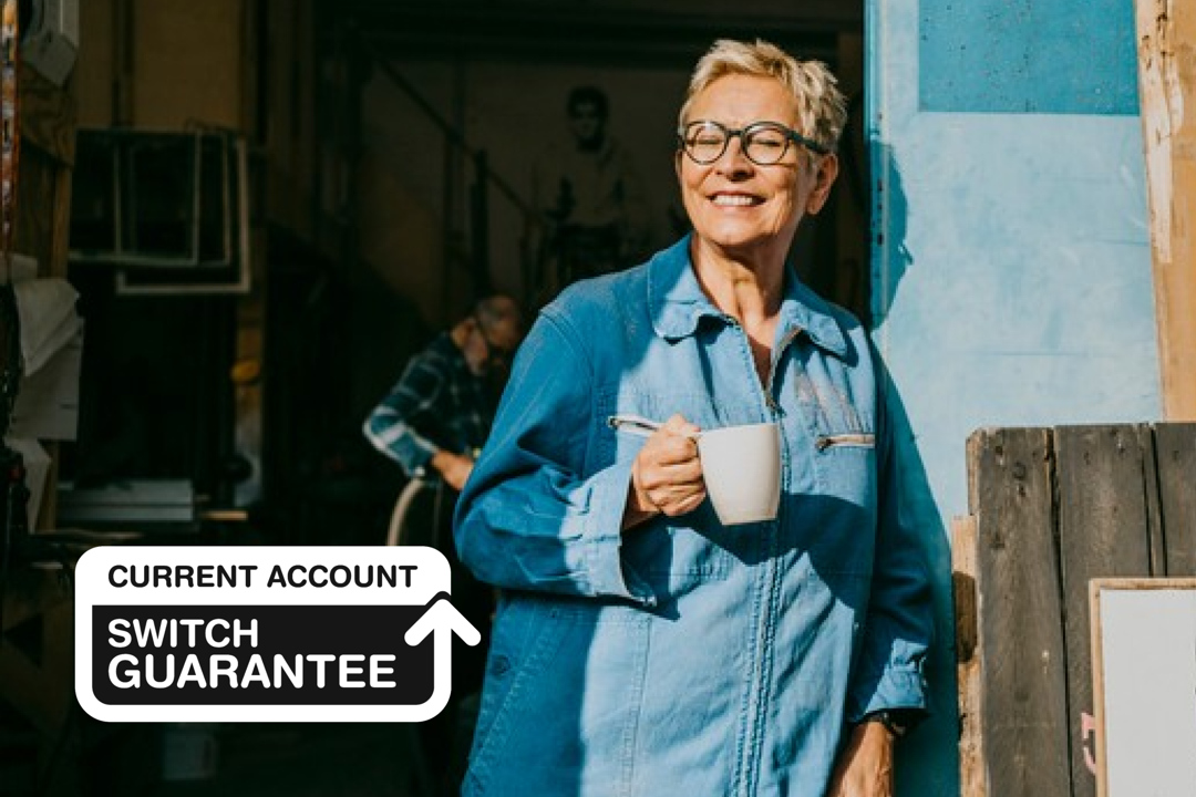 Women smiling with a cup of coffee