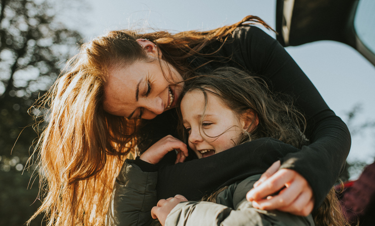 mother and daughter hugging