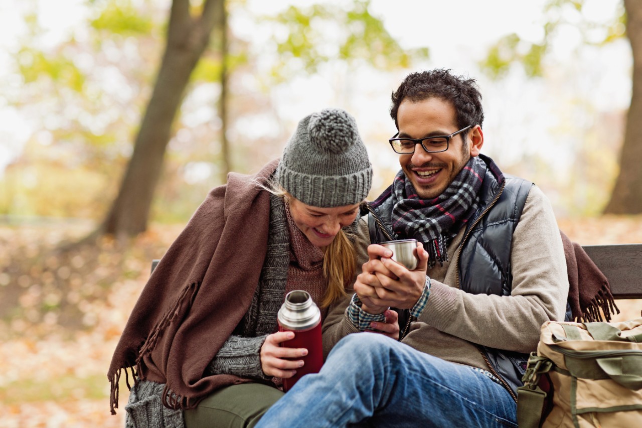 Couple on beach using NatWest Premier service