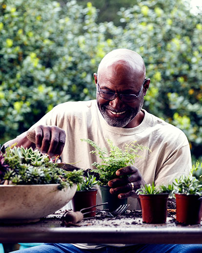 Man planting flowers